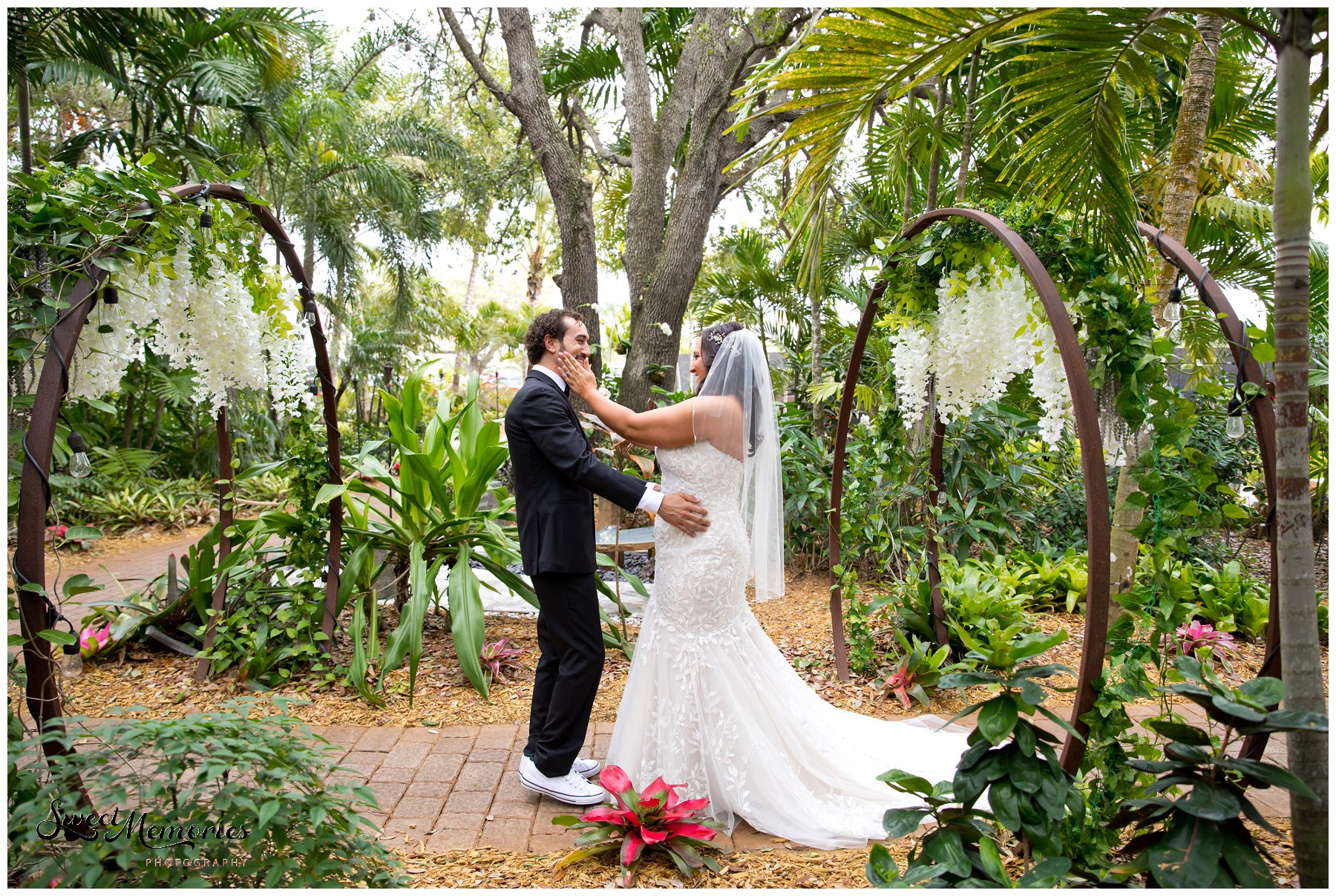 Tropical yet classic, Janice and Michael's Living Sculpture Sanctuary wedding in Davie was the perfect mix of romantic, hilarious, fun, sweet, and chic! After having met at a restaurant, his persistence, and a romantic proposal at the Flamingo gardens, they are now ready to tie the knot!