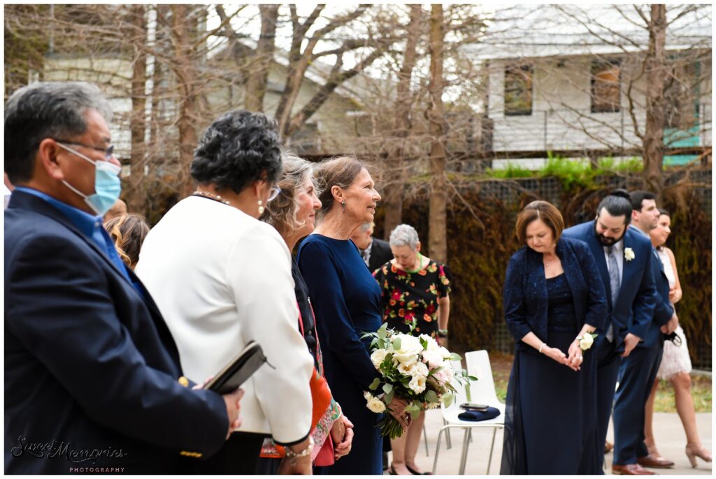 Proud mom watching her daughter get married.