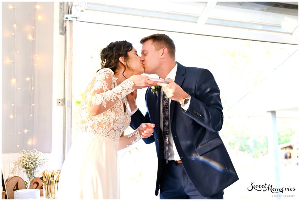 It was a messy cake-cutting but they made it through and sealed it with a kiss.