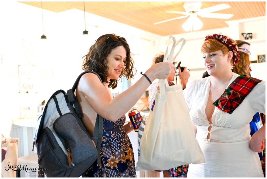 Handing out handmade gift bags to their guests.