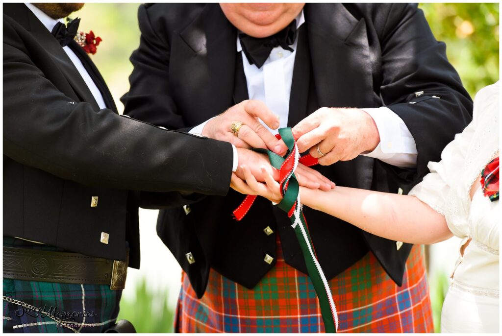 Handfasting ceremony with the tying of the ribbons.