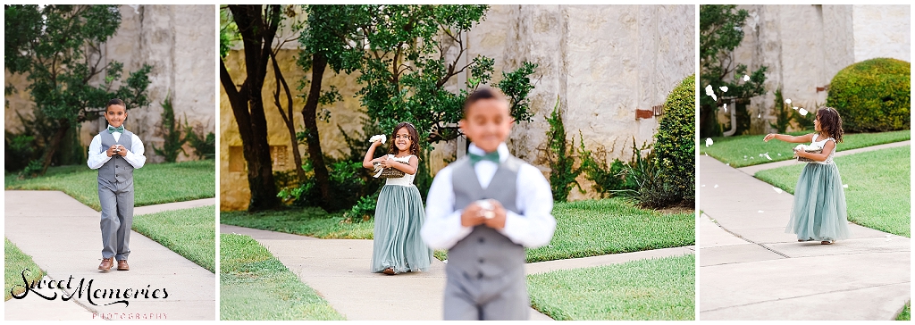 The flower girl and ring bearer walking down the aisle.