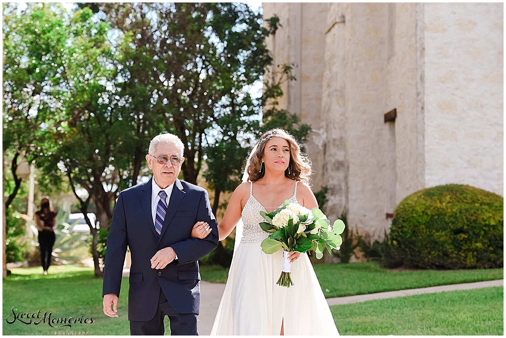 The bride walking down the aisle.