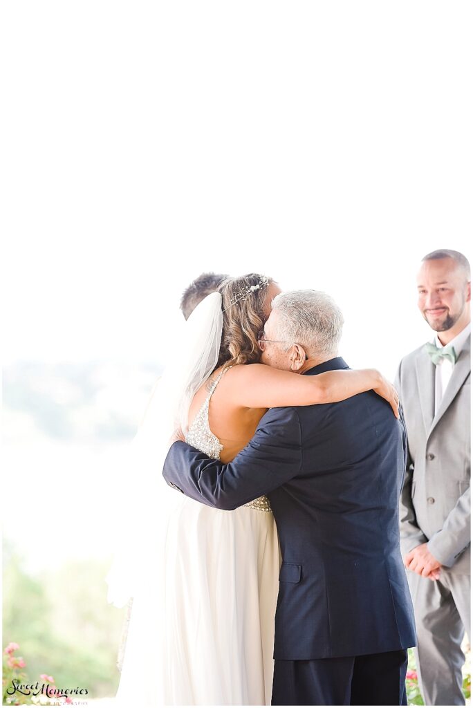 The bride's dad giving her away.