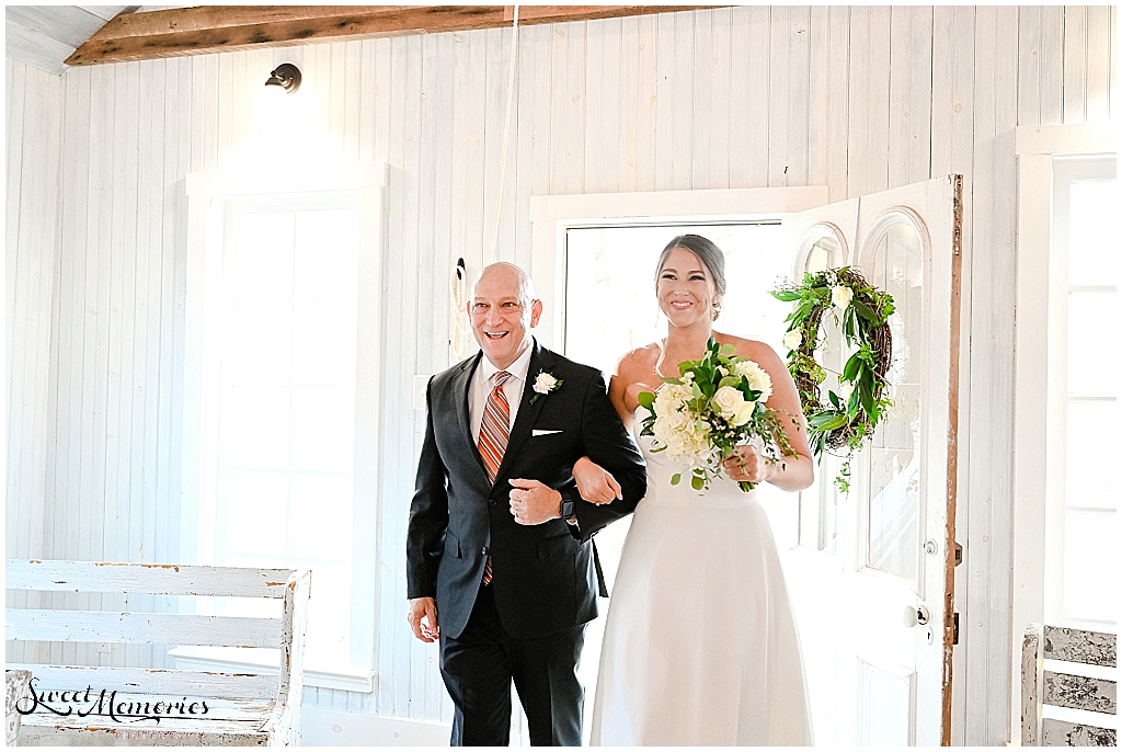 Proud papa walking the bride down the aisle.