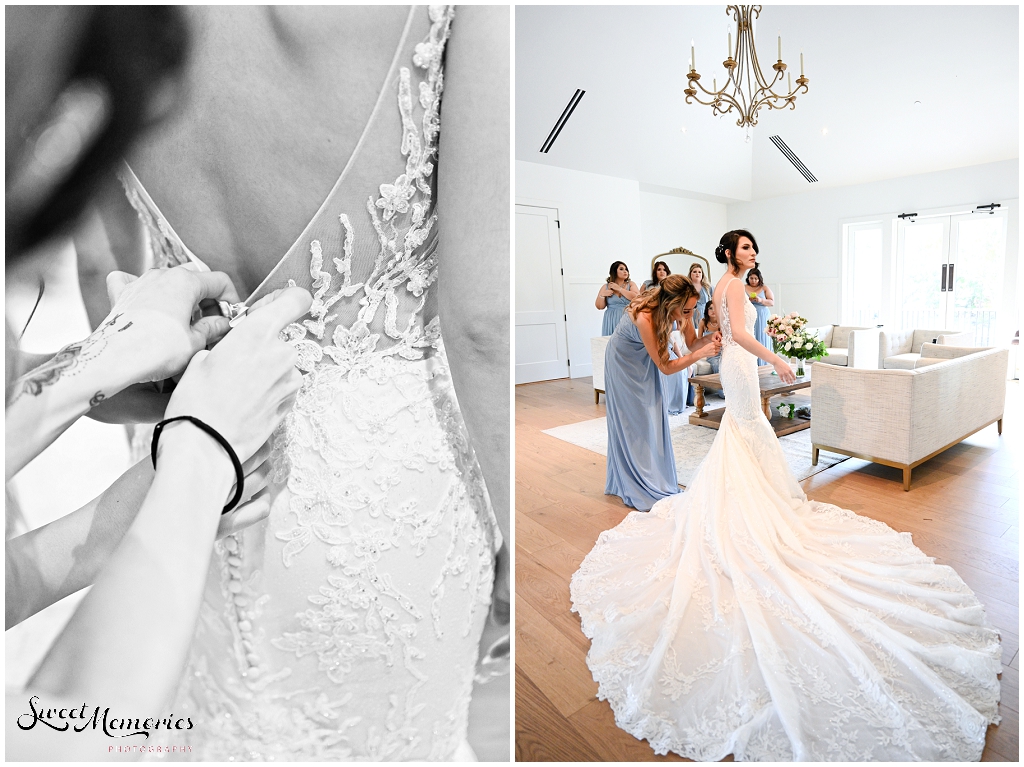 Buttoning up the bridal gown.