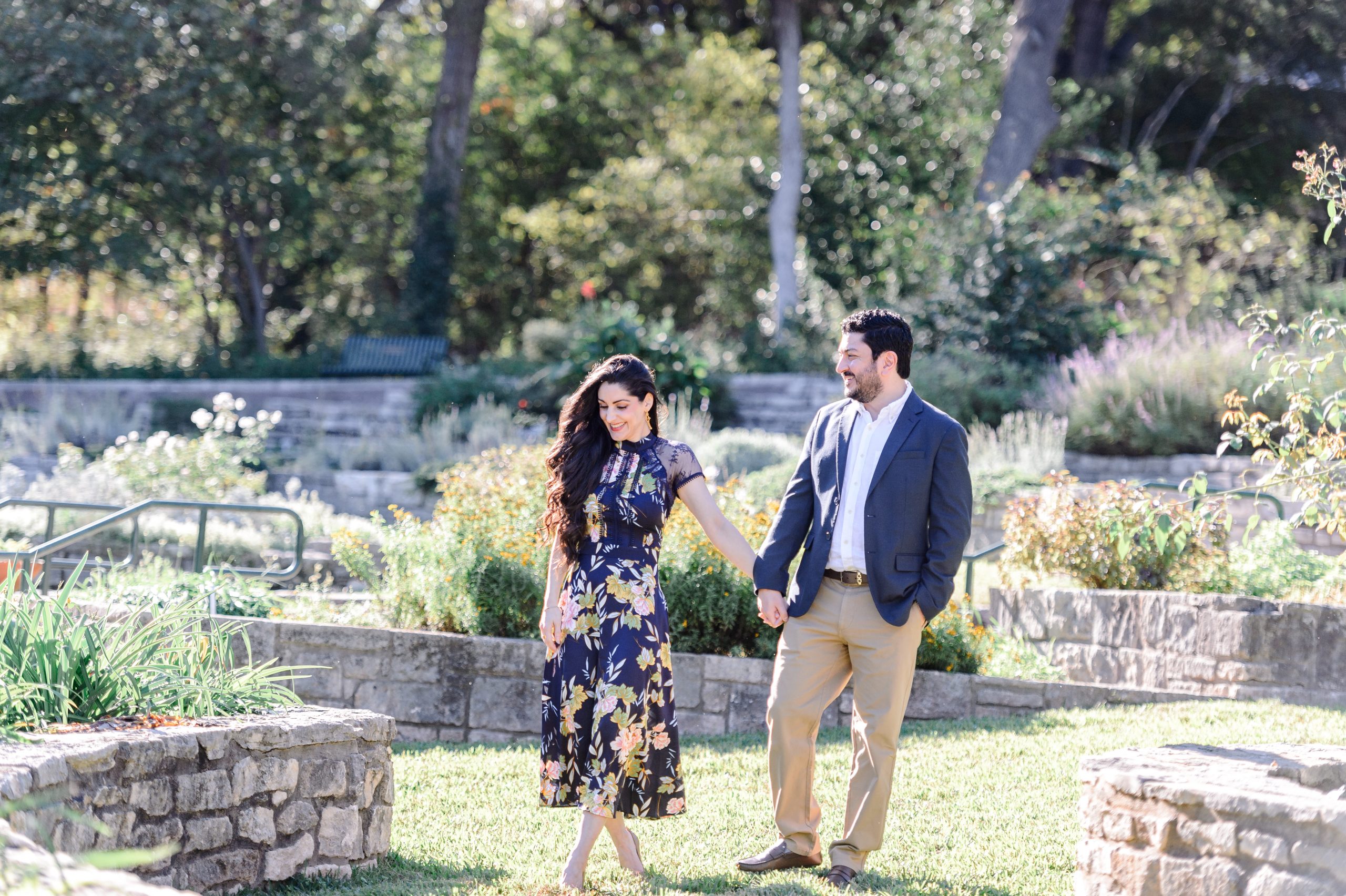 couple walking through zilker botanical garden being photographed by Naomi, an Austin texas photographer