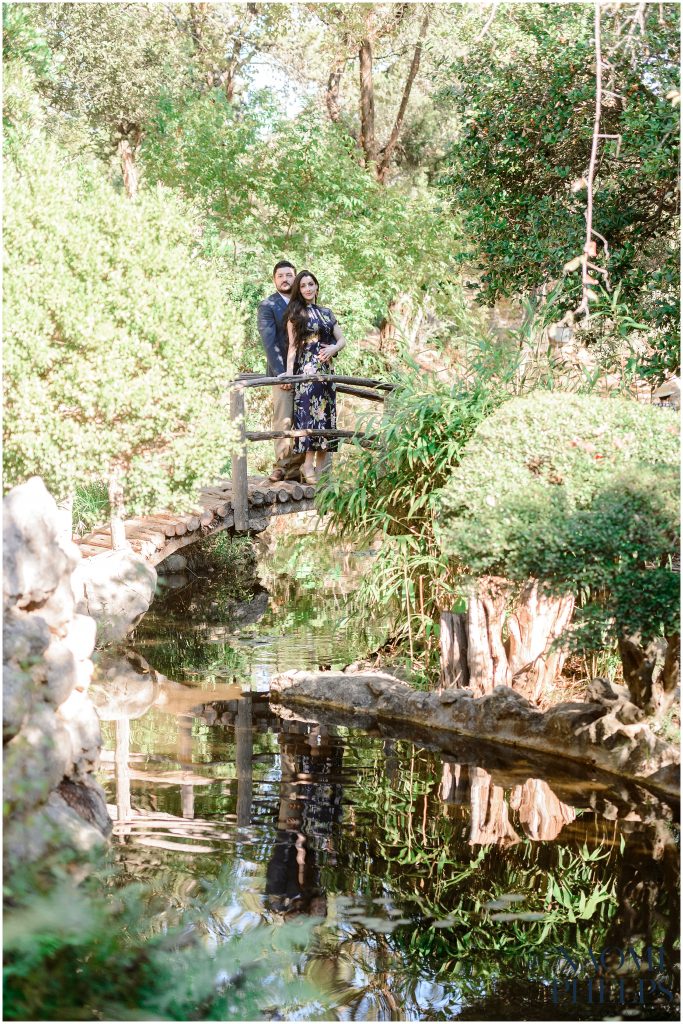 Austin Texas Photographer shooting couple on a bridge at Zilker botanical garden.