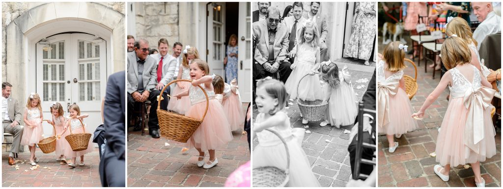 The flower girls walking down the aisle at the Downtown Austin wedding ceremony.