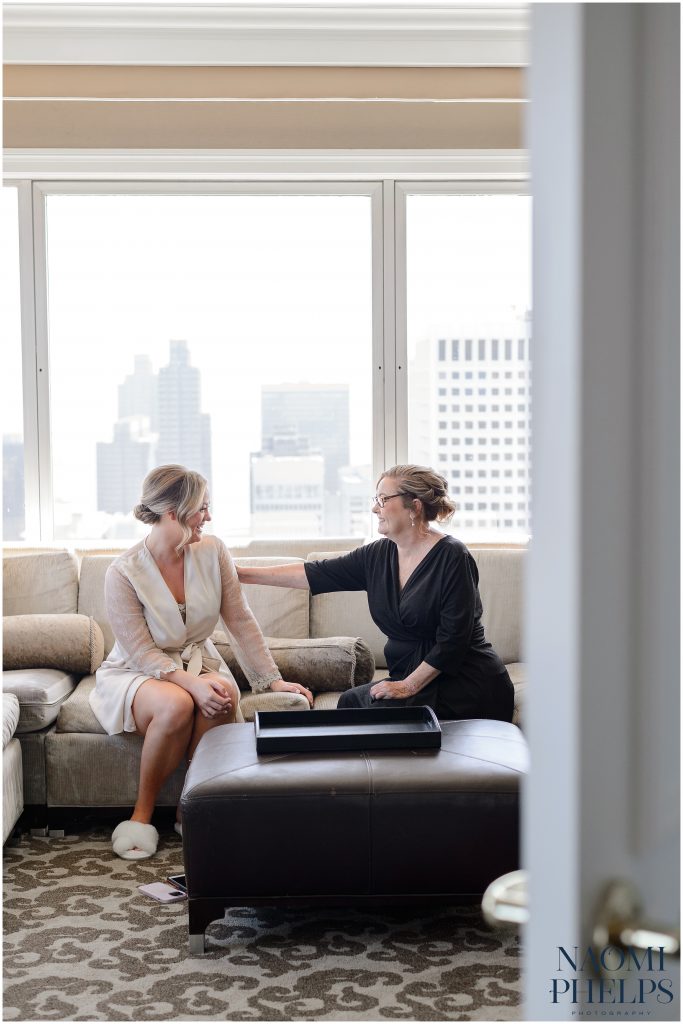 The bride and her mom having a moment before her San Francisco City Hall wedding.