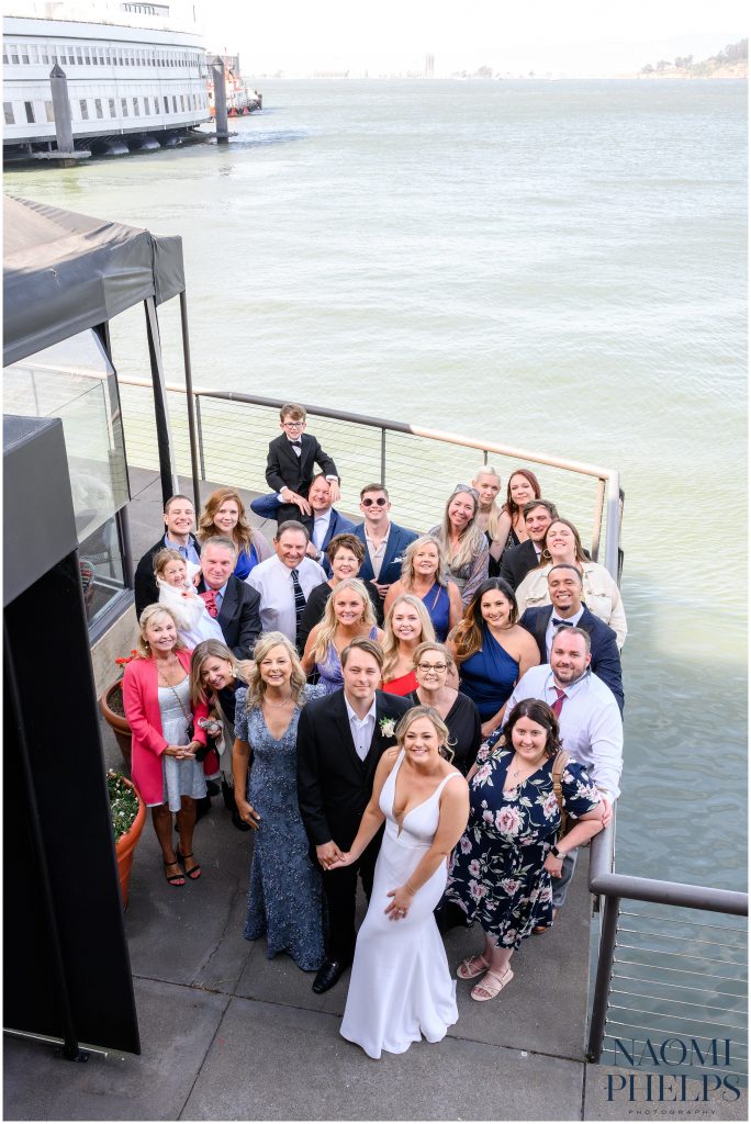 A group photo outside of the wedding reception venue.