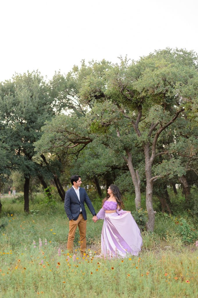 Couple posing for engagement photos in Austin TX at Brushy Creek Park.