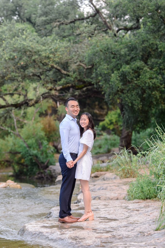 Couple smiling for their engagement photos in Austin, TX.