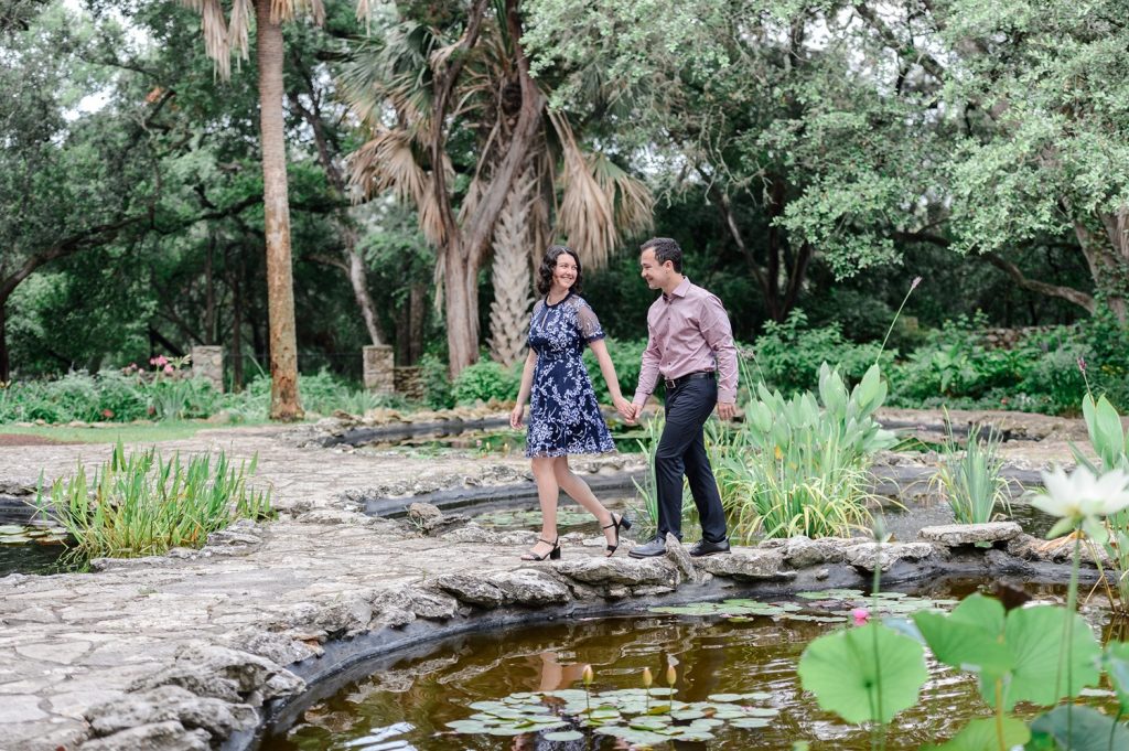Couple walking through Mayfield Park for their engagement photos in Austin, TX.