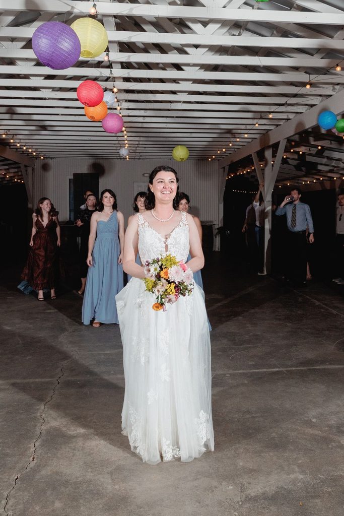 Bouquet toss at Pecan Springs Ranch wedding.