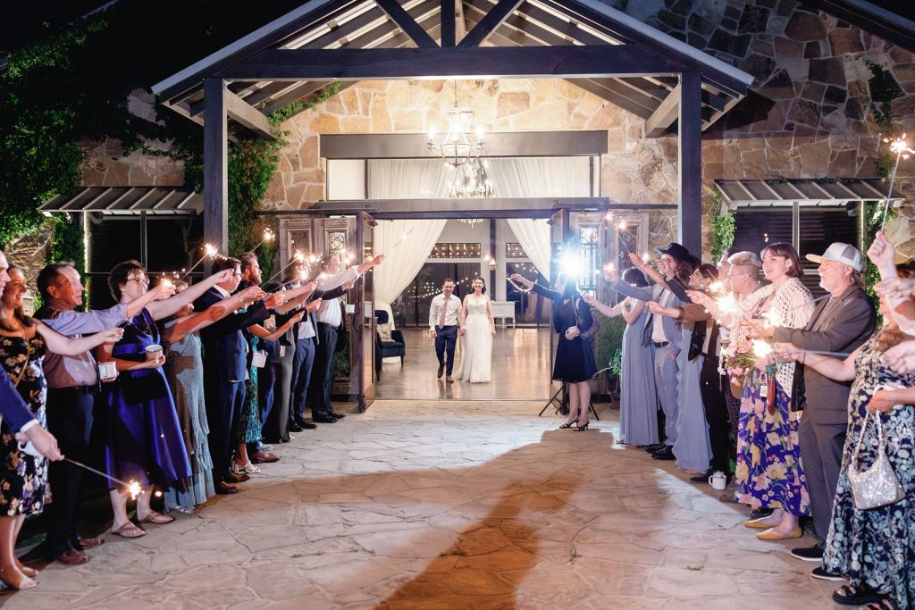 Grand exit at Pecan Springs Ranch wedding.