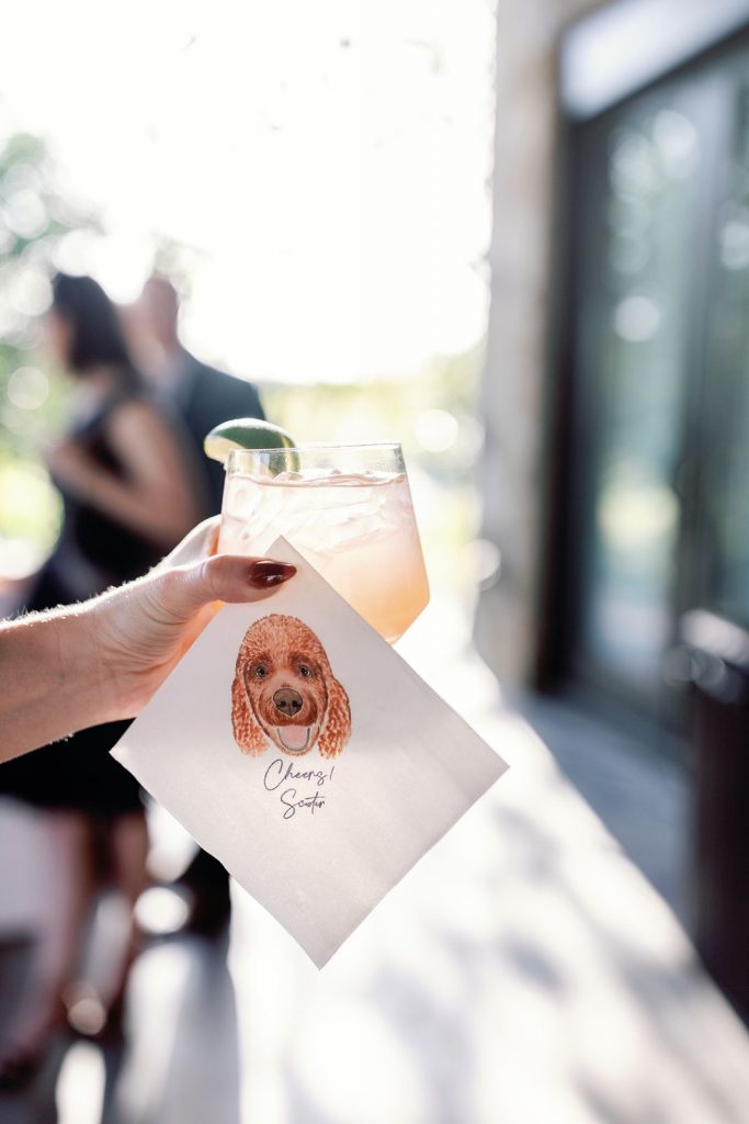 Custom cocktail napkin with hand illustration of the couple's dog.