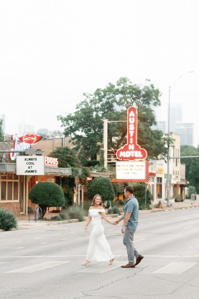 Engaged couple crossing South Congress in Austin, TX.