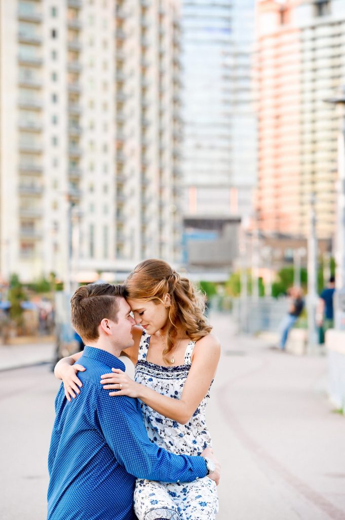 Man and woman posing at Zilker Metropolitan Park for engagement photos in Austin, TX.