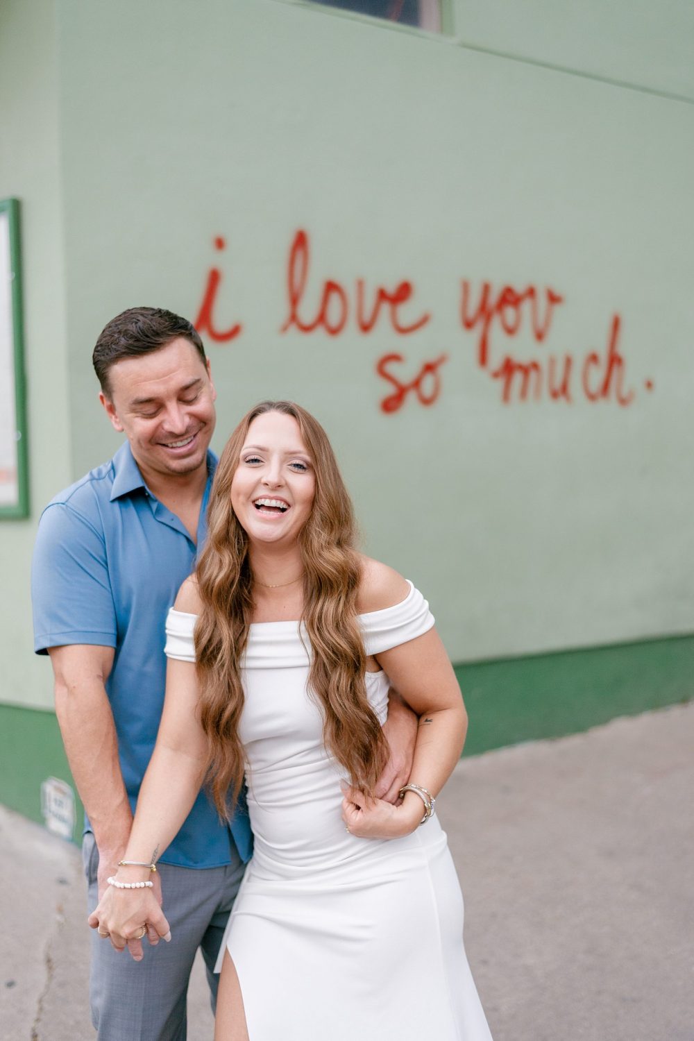 Engagements photos at the "i love you so much" mural in downtown Austin