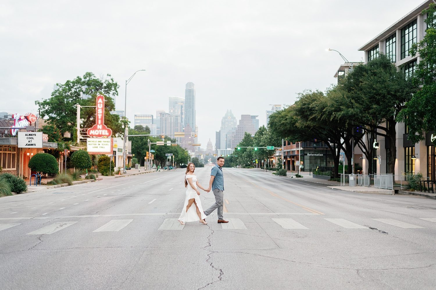 Couple walking across South Congress in downtown Austin
