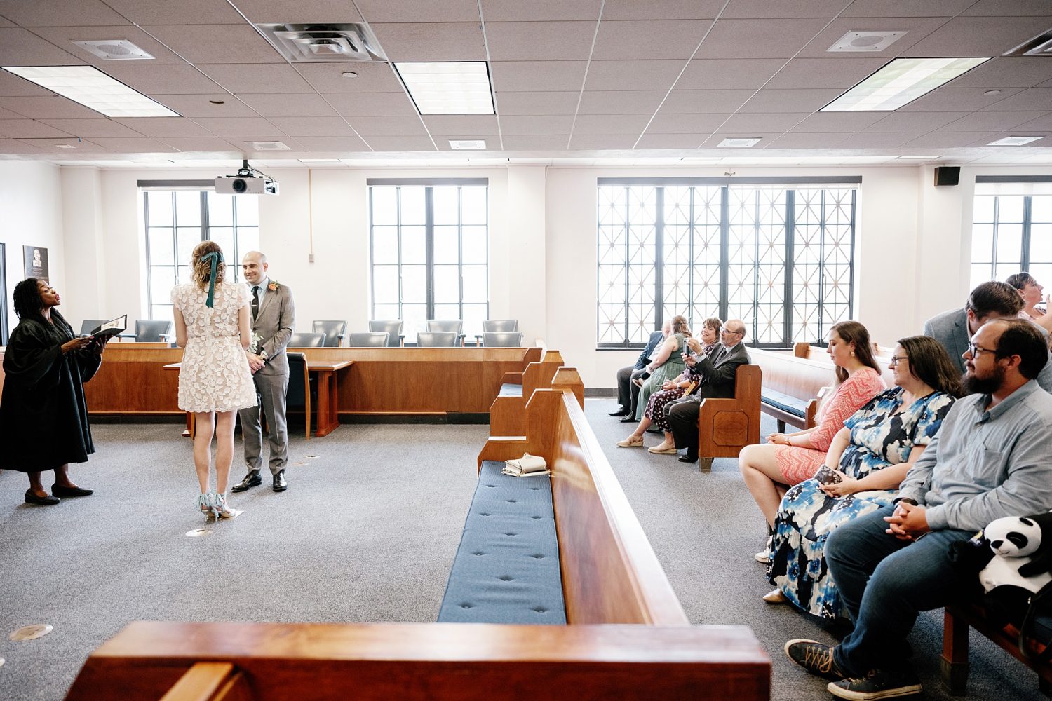 Couple getting married at Travis County Courthouse with family and friends