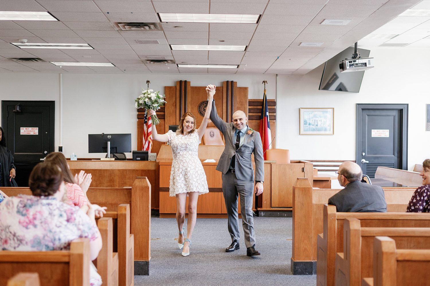 Couple celebrating getting married at downtown Austin Courthouse