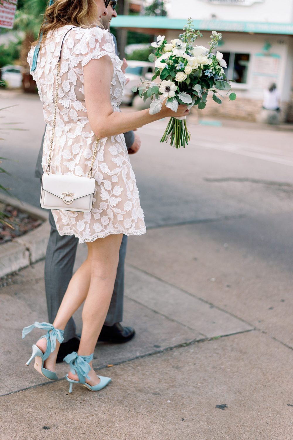 White floral elopement dress with white floral bouquet